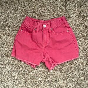 pink denim shorts.